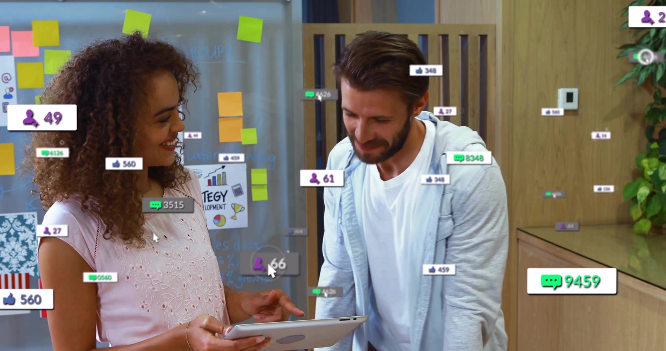 Marketing duo holding tablet, pointing and reacting to social notifications for campaign review