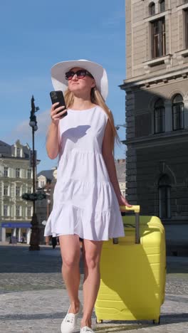 shot of woman with luggage walking through railway station