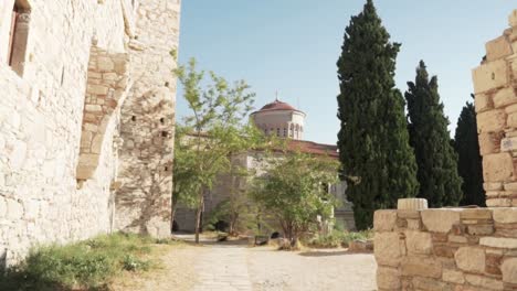 ancient ruins and a church in a sunny historical site