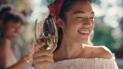 beautiful woman dancing with friends at summer dance party drinking wine enjoying summertime social gathering having fun celebrating on sunny day 4k footage