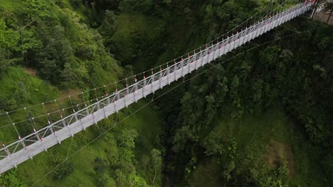 A-tourist-destination-for-the-Girpasang-suspension-bridge-which-has-a-means-of-crossing,-namely-the-gondola-on-the-slopes-of-Mount-Merapi