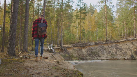 man traveling relaxing alone with river canyon view. man survival traveling hiking at river active healthy lifestyle. high quality 4k footage