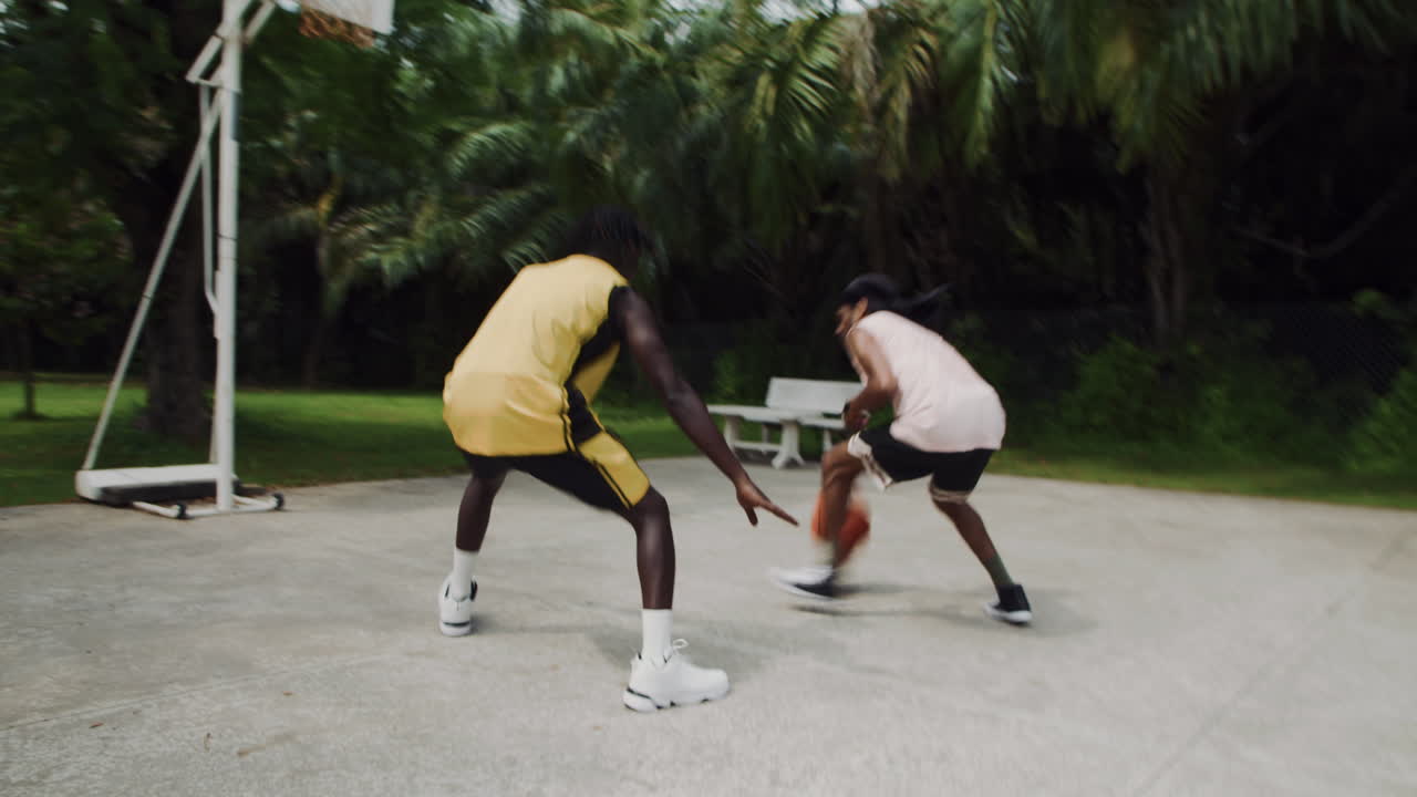 Black Sportsmen Playing Streetball at Weekend on Playground