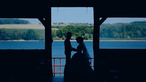lovely wedding couple. silhouette of romantic and happiness couples near lake