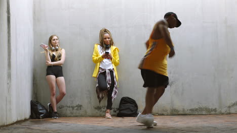 young people socializing and dancing in urban setting