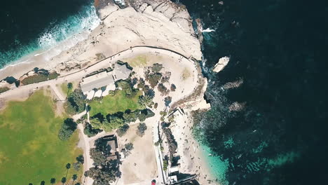 Upward-overhead-aerial-of-La-Jolla-Cove,-beach-and-buildings-in-San-Diego