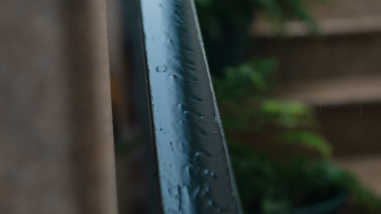 Raindrops on Metal Railing, Shallow Focus