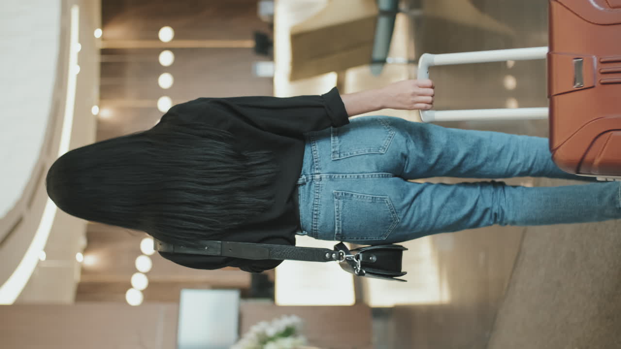 Woman Arriving in Hotel