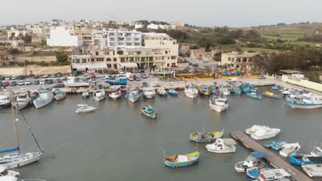 maltese marina aerial view yacht drone shot boat harbor luxury tourism coastline travel marsaxlokk malta