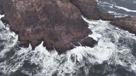 Waves-crashing-on-the-rocks-in-the-ocean---rewinded