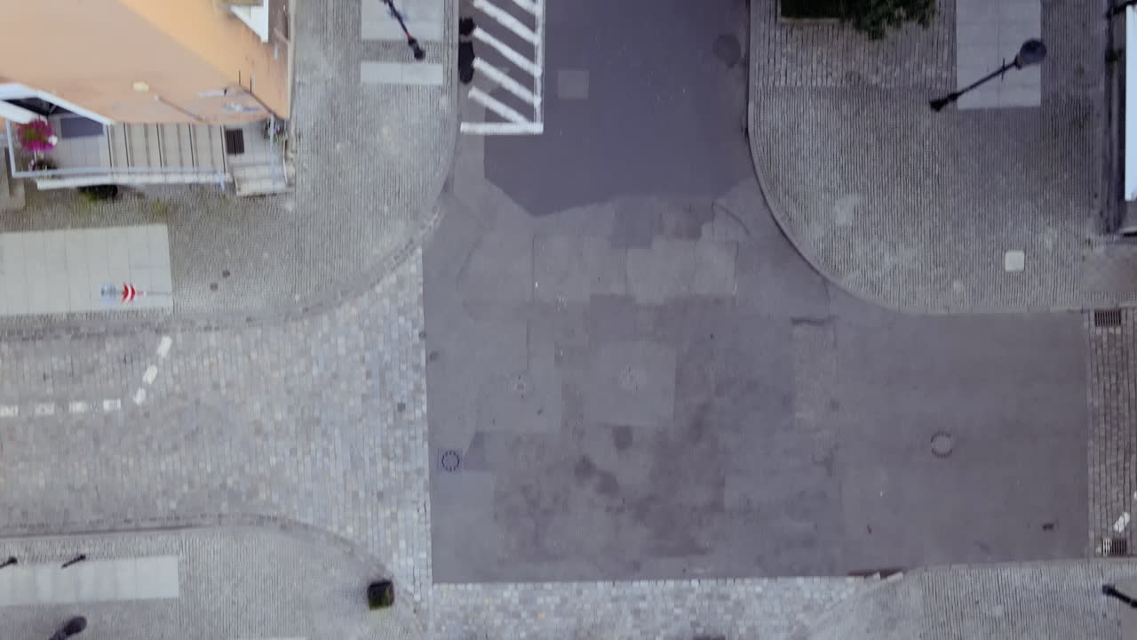 Aerial top down the city's empty streets and promenade, deserted pavements and cities during a pandemic