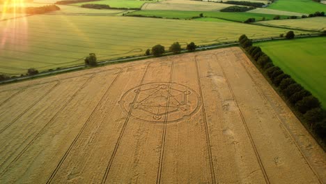 crop circle fortnite molecular geometry pattern aerial view on wiltshire sunset wheat field countryside distant orbit right