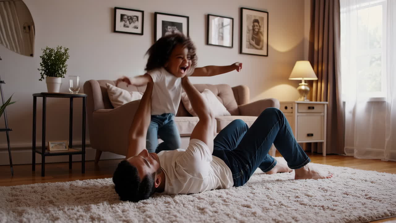 Joyful father and daughter playing together in the living room