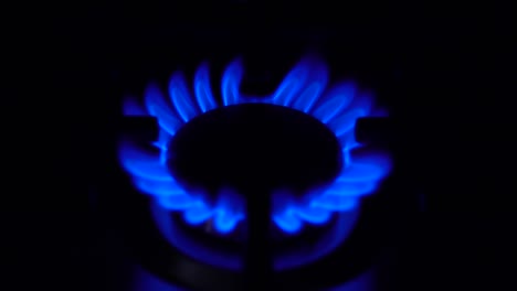 the gas burner switches off in the dark. stove works at the household gas. the flame is blue.