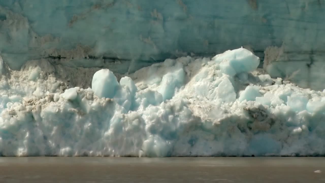 Ice carving off alaskan glacier Free Stock Video Footage