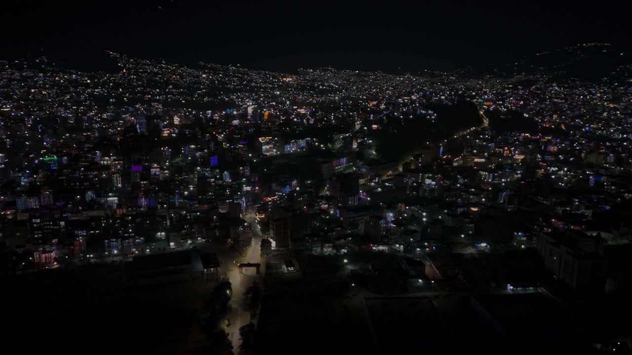 Beautiful drone footage of Kathmandu city at night during Diwali (Tihar), glowing with colorful lights, diyas, and decorations that reflect Nepal’s vibrant culture, joy, and festive celebration