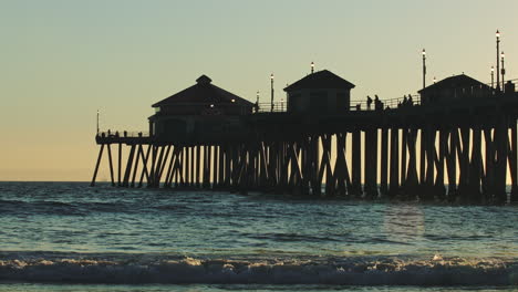 silhouette of the huntington beach pier and sunset