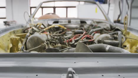 open car engine standing in a township workshop being prepared to be repaired