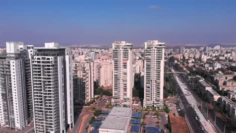 aerial view of modern city with high-rise residential buildings under a clear sky