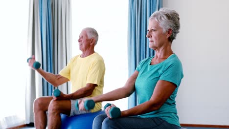 Senior-citizens-exercising-with-dumbbells