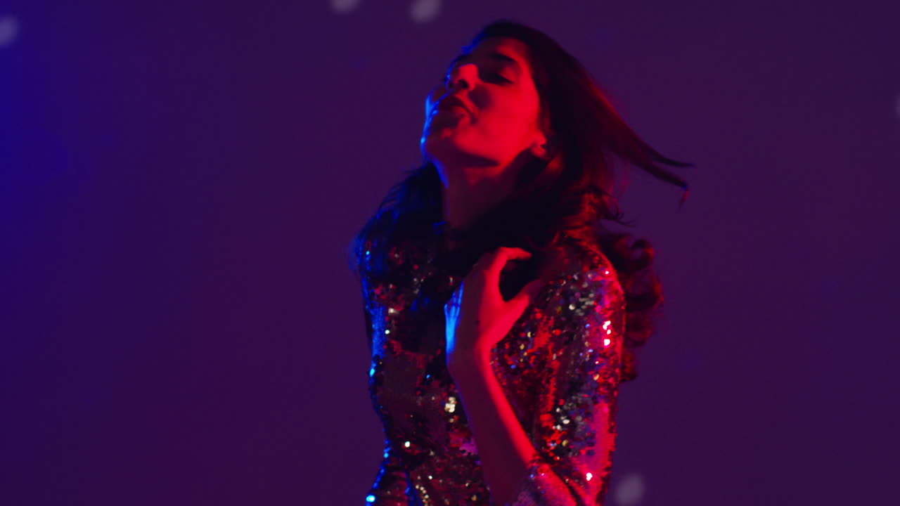 Close Up Of Woman In Nightclub Bar Or Disco Dancing With Sparkling Lights 10