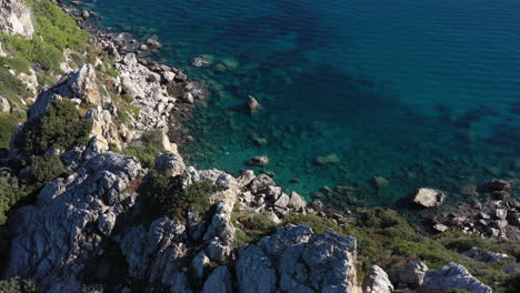 sea-and-rocks-aerial-drone-shot-Porqeurolles-cliffs-France-sunny-day