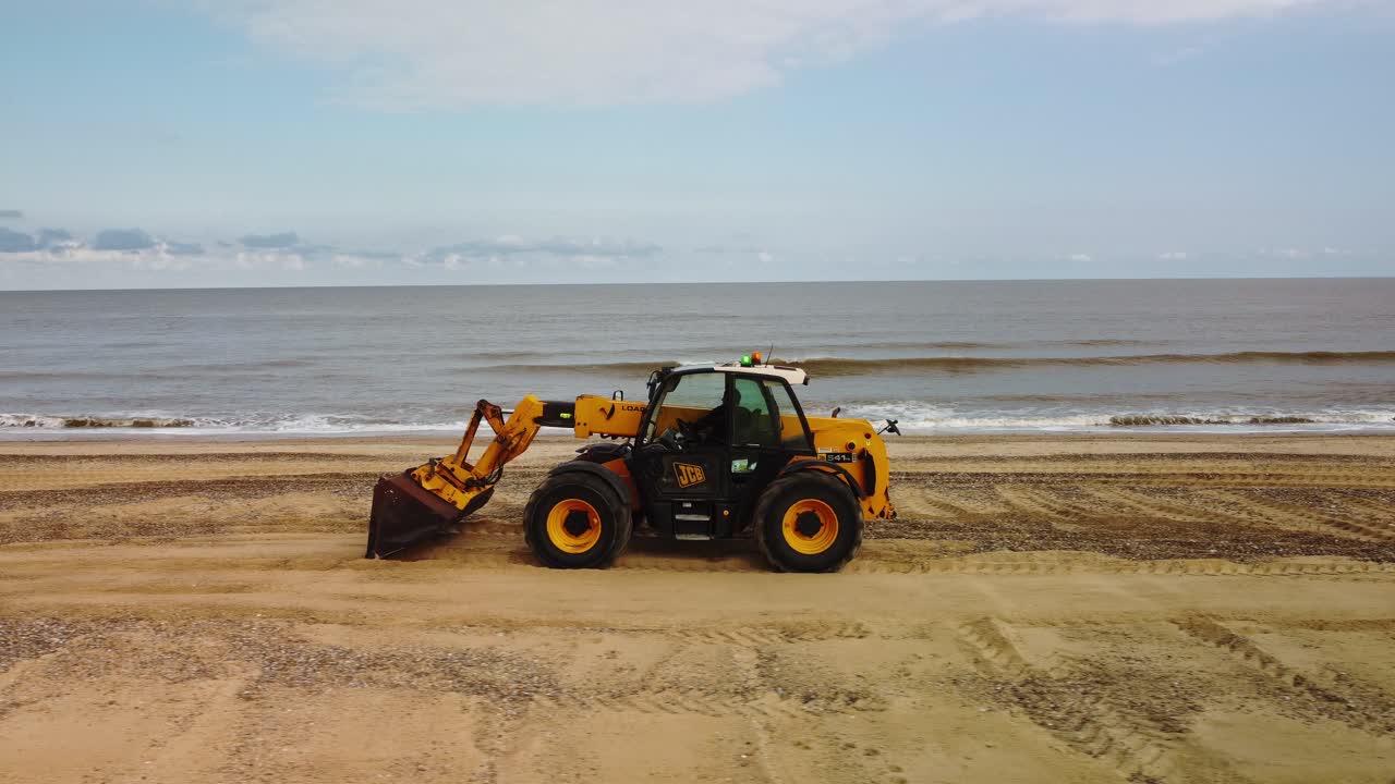 Aerial Drone Footage of a Digger Working On Gorleston-On-Sea Beach, Norfolk