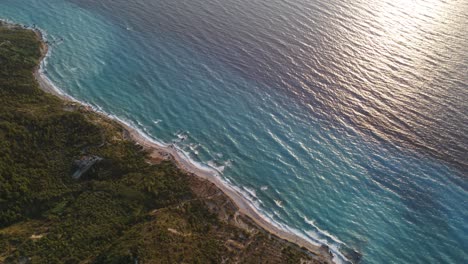 idyllic megali petra beach with its turquoise waters during sunset, lefkada island