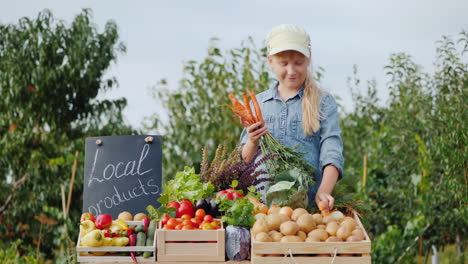 niña granjera en el mostrador con verduras
