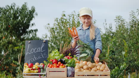 little farmer girl at the counter with vegetables