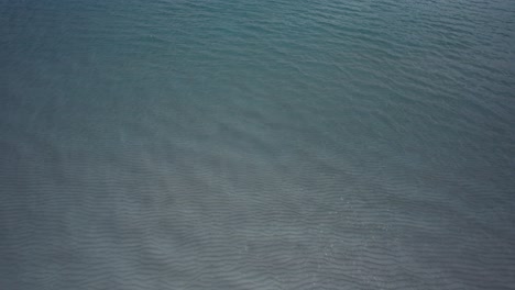 clearwater waves of emerald waters on white sand beach on the gulf of mexico aerial view with drone