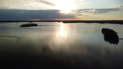 Aerial-Sunset-of-Islands-and-Boat-on-Lake-Huron,-Michigan