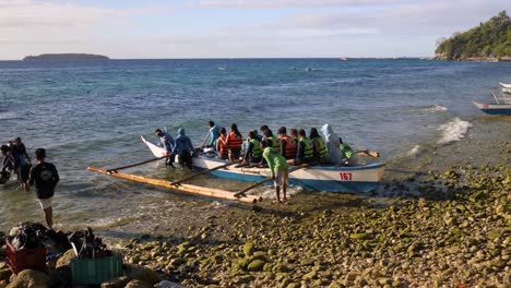 tourists aboard a boat were about to embark on a whale shark watching experience in oslob, cebu, philippines - wide shot