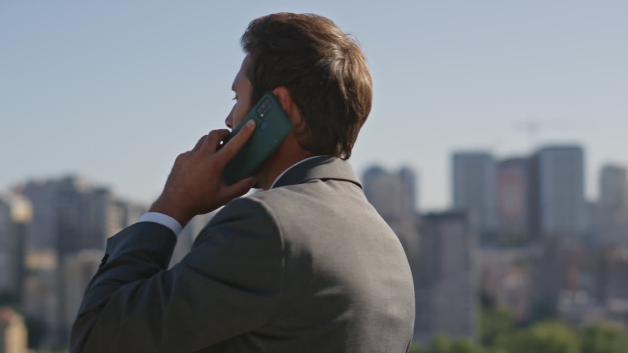 Bearded executive speaking cellphone on street close up. Businessman calling