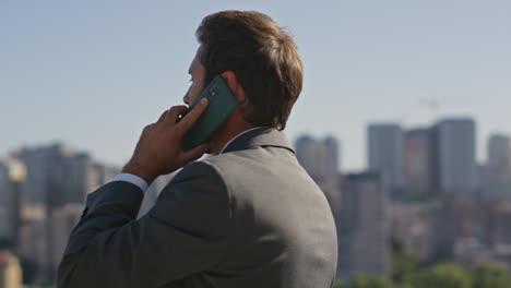bearded executive speaking cellphone on street close up. businessman calling