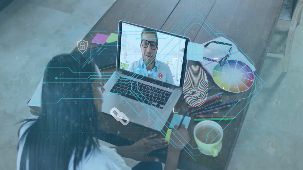 Digital interface animation over person video conferencing on laptop at desk