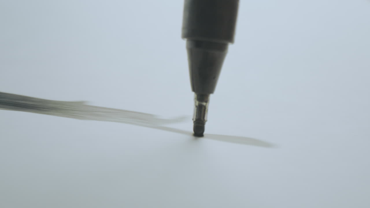 Close-up of a marker drawing on paper