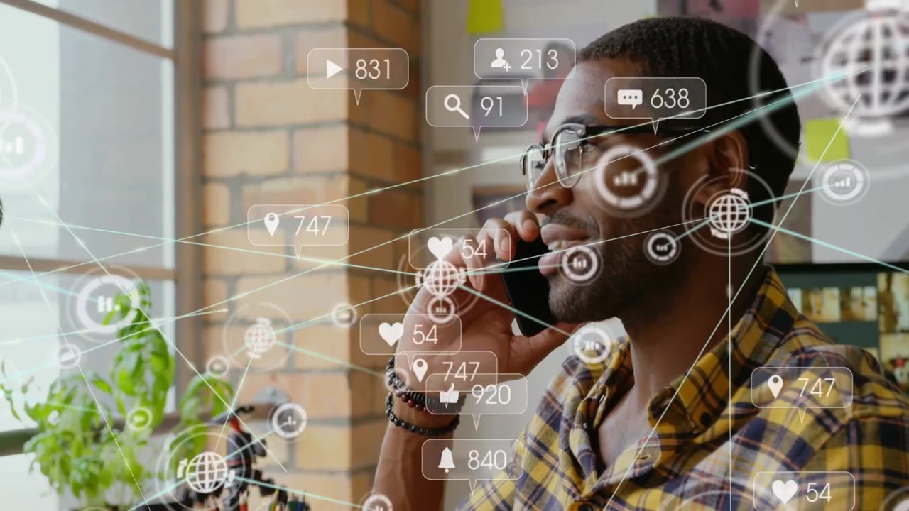 Man taking phone call, network nodes and alerts growing around him while checking marketing metrics