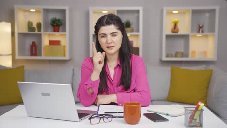 home office worker woman talking motivationally to camera.