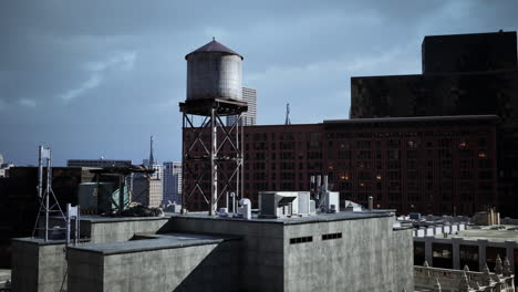 water tower on rooftop of city building