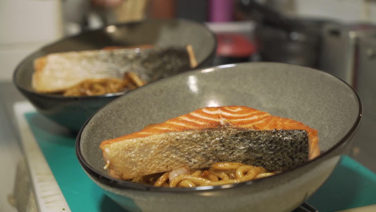 Salmon and noodle dish preparation