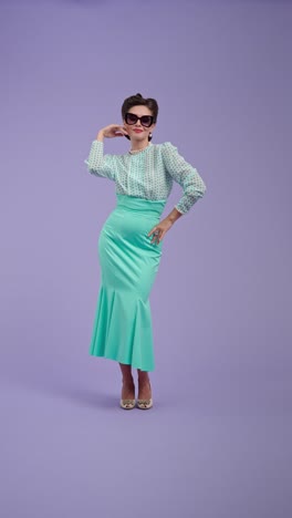 stylish woman in retro pin-up outfit on purple background