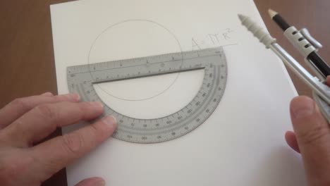 Mathematician-demonstrates-how-to-determine-the-area-of-a-circle-