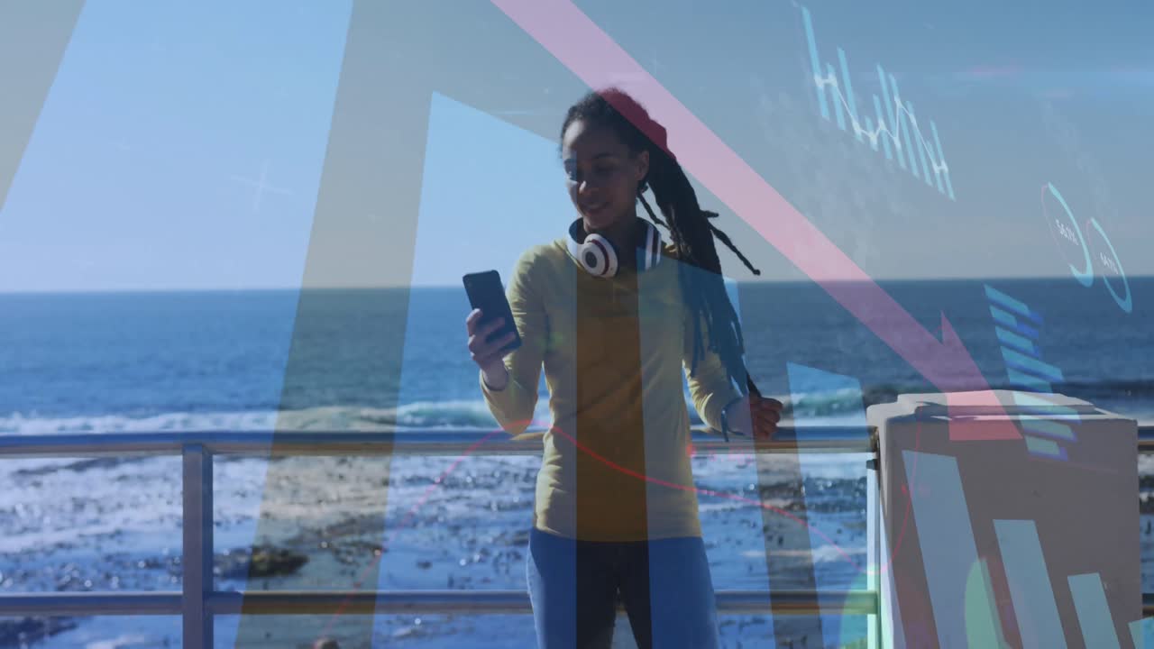 Animation of statistics and graphs over woman taking selfie on promenade by the sea