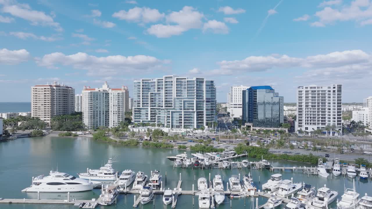 Soar above Sarasota's downtown charm, forward dolly shot descending lower