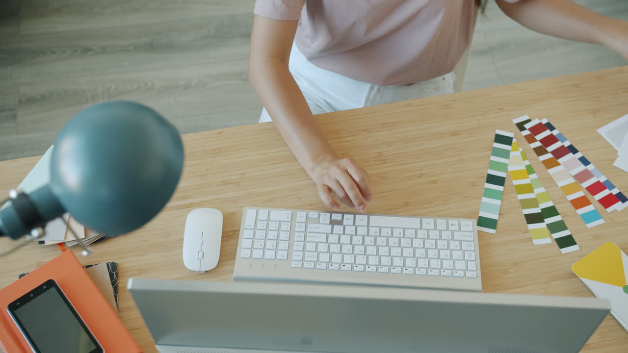 Woman working on design project at desk