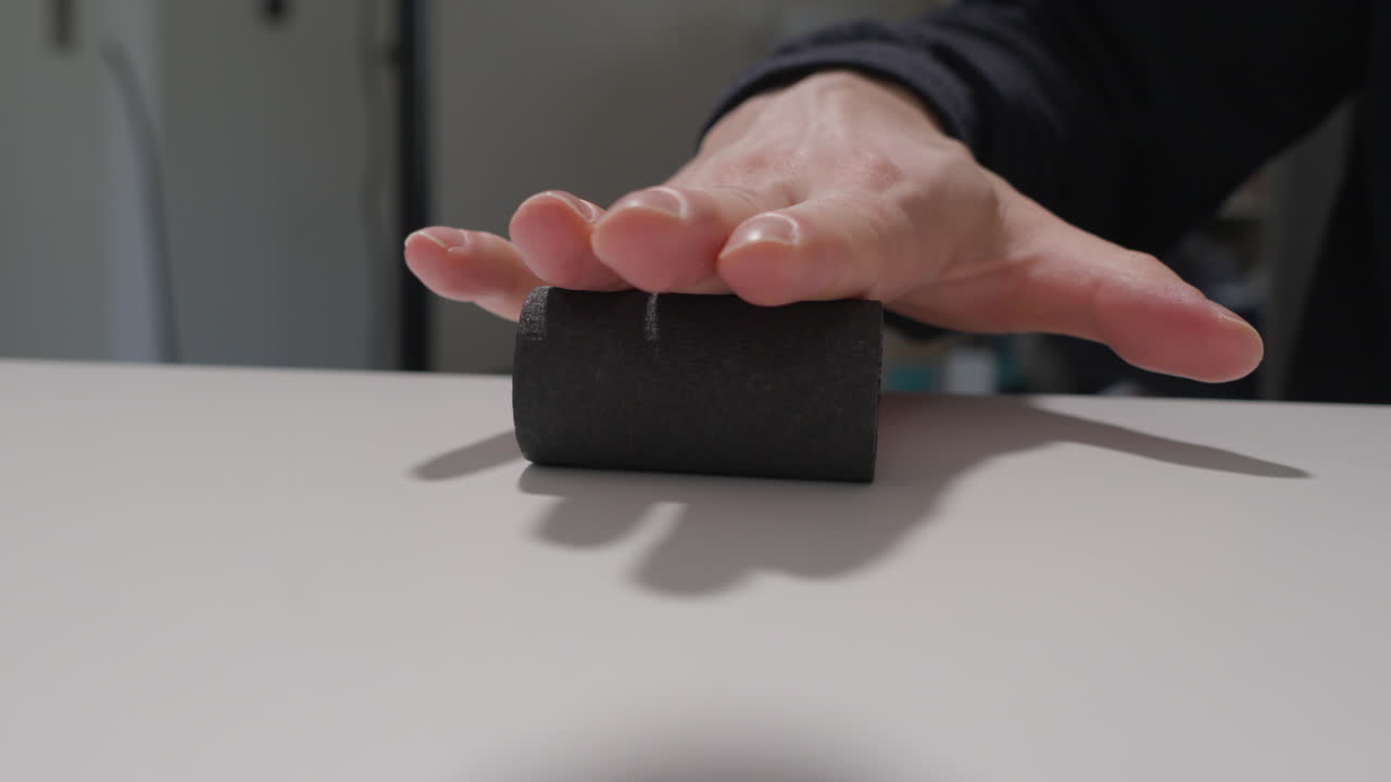 Self massaging hand with a foam roller for pain relief