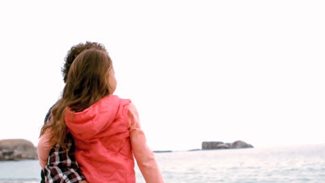 Father-and-daughter-looking-at-the-sea