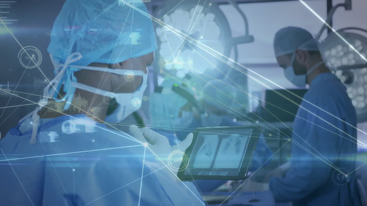 Using tablet with data processing animation, medical professionals performing surgical procedure
