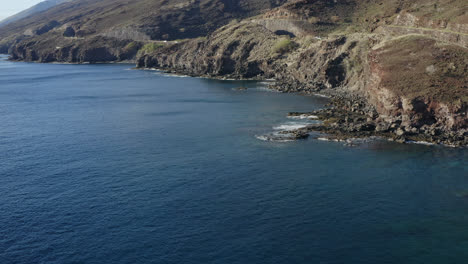 drone dolly view of the rough coast of the auau channel on maui on a sunny day